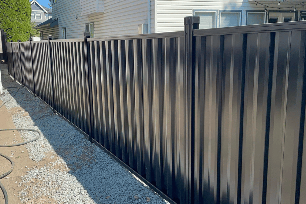 Black metal privacy fence installed by fence contractors in Abbotsford, BC