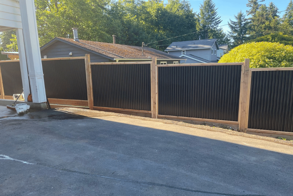 Black metal and cedar privacy fence installed by fence contractors in Abbotsford